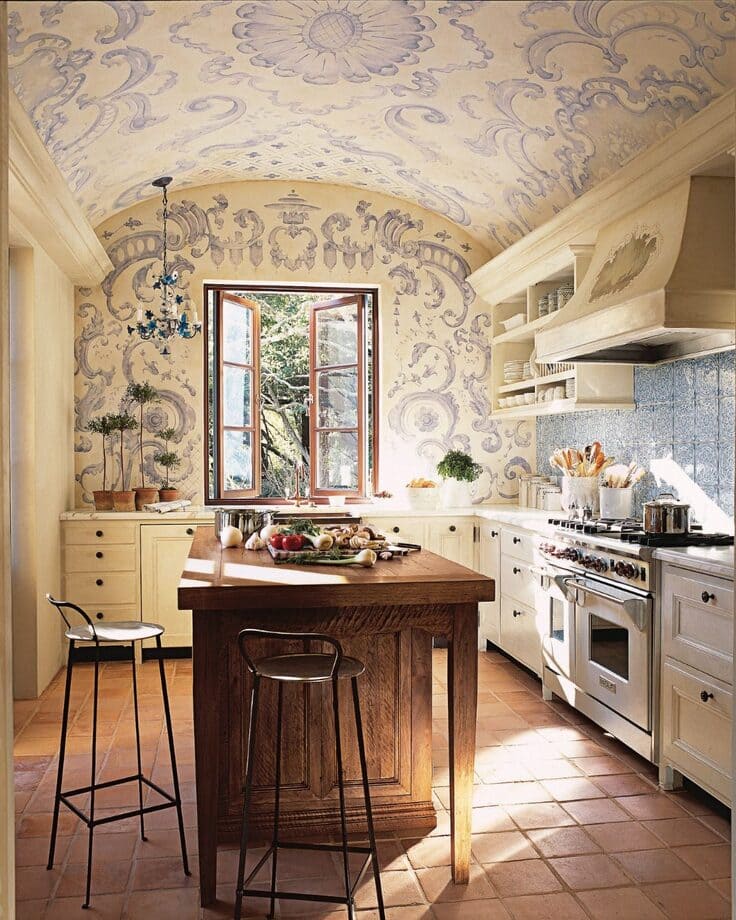 French country kitchen with hand-painted ceiling and terracotta floors