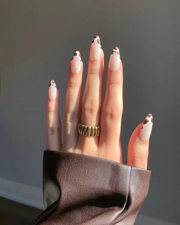 Brown cow print french tips detailed nails