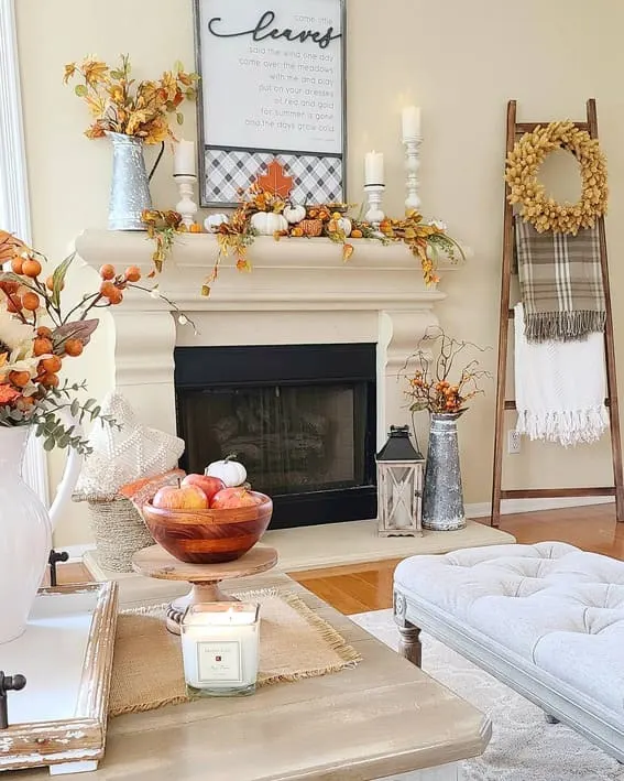 Fall mantel with pumpkins, cozy decor, and autumn accents.
