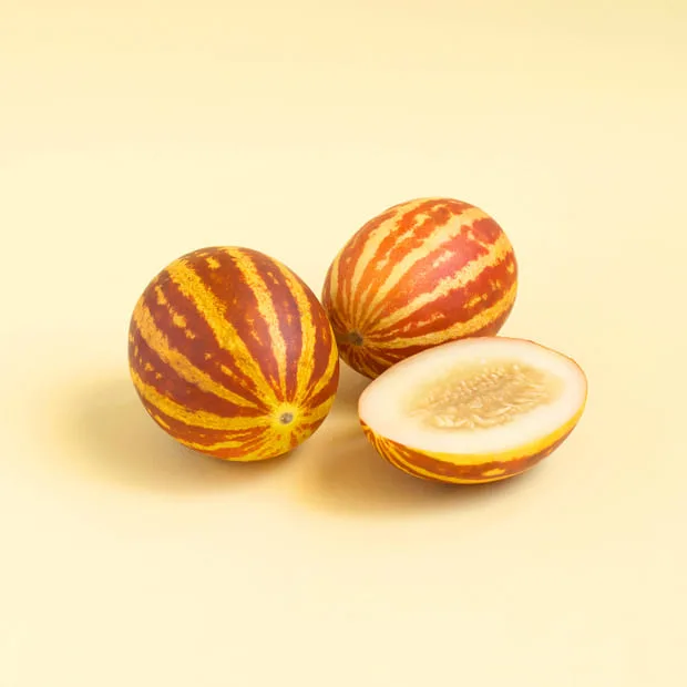 mini melons with striped skin like watermelon